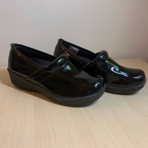 Glossy black Dansko-like clogs